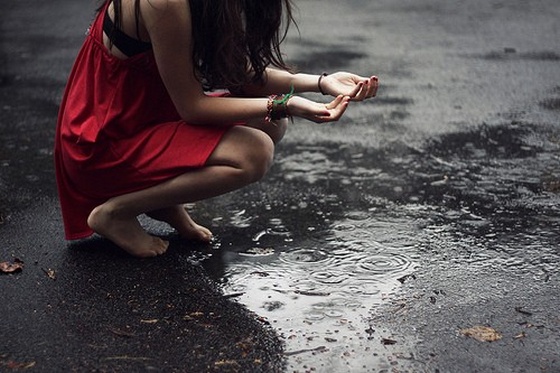 girl walking alone in rain
