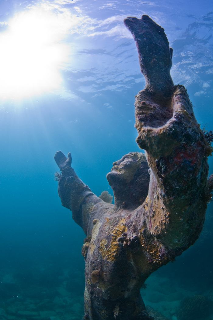 Christ of the Abyss is a submerged bronze statue of Jesus, of which the original is located in the Mediterranean Sea off San Fruttuoso between Camogli and Portofino on the Italian Riviera. It was placed in the water on 22 August 1954 at approximately 17 metres depth, and stands c. 2.5 metres tall. Various other casts of the statue are located in other places worldwide, both underwater and in churches and museums. The sculpture was created by Guido Galletti after an idea of Italian diver Duilio Marcante. The statue was placed near the spot where Dario Gonzatti, the first Italian to use SCUBA gear, died in 1947. It depicts Christ offering a blessing of peace, with his head and hands raised skyward.