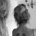 TWO ANGEL WING TATTOOS ON BACK 