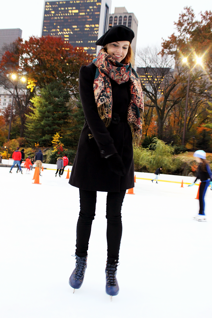 Ice skating in Central Park in fall. Fashion Blogger outfit with a beret.