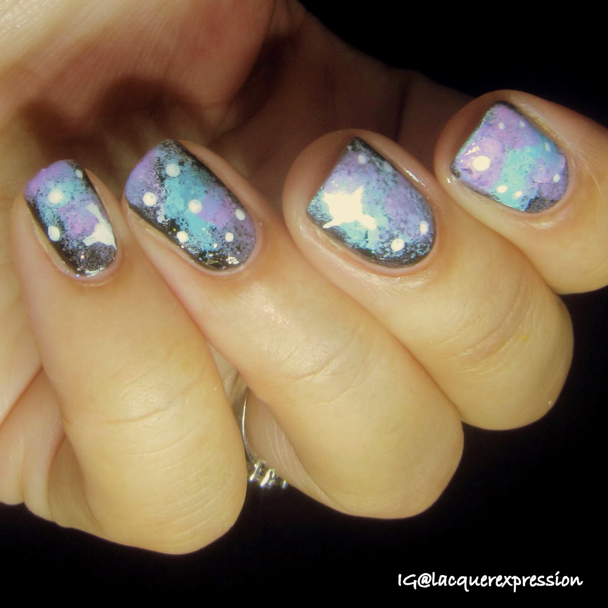 Galaxy nail art using starry night polish by sinful colors and day glow teal and ultra violet polish by maybelline