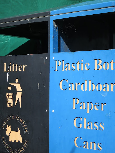 Blue bin for recycling. Black for litter.