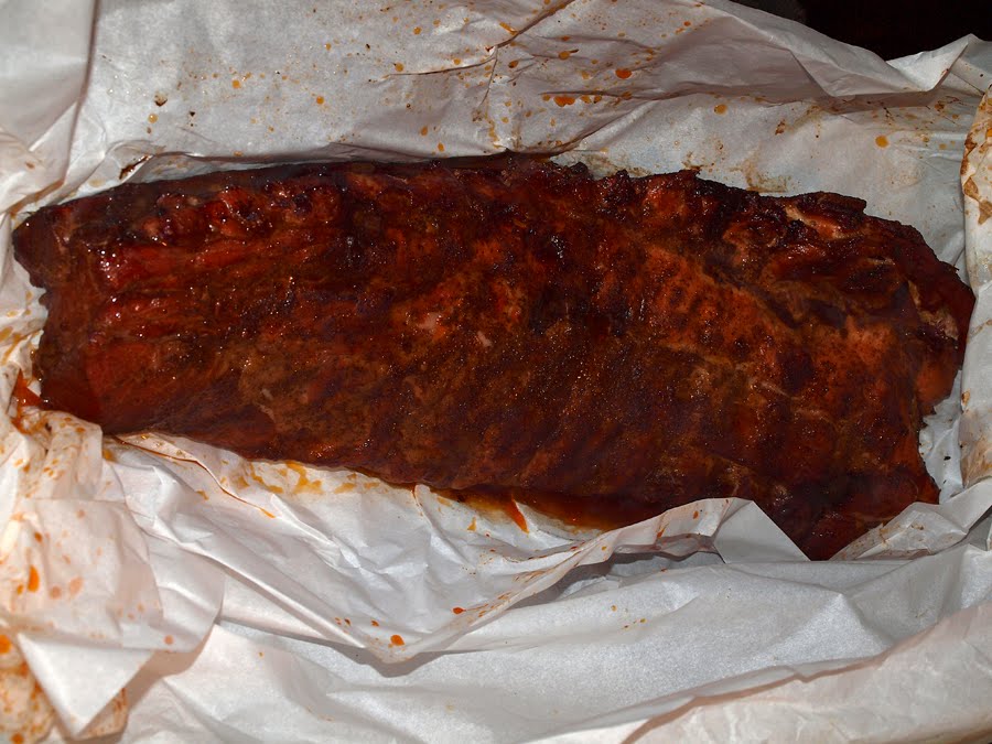 Pellet Smoker Cooking Pork Back Ribs in Parchment Paper