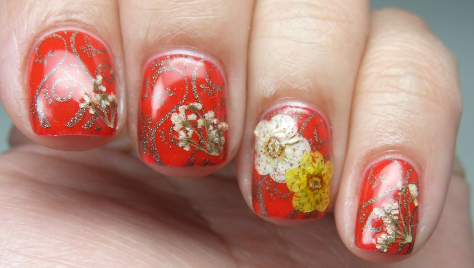 3. Festive Poinsettia Nail Art Design with Dried Flowers - wide 2