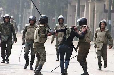 egyptian army dragging a woman by her hair