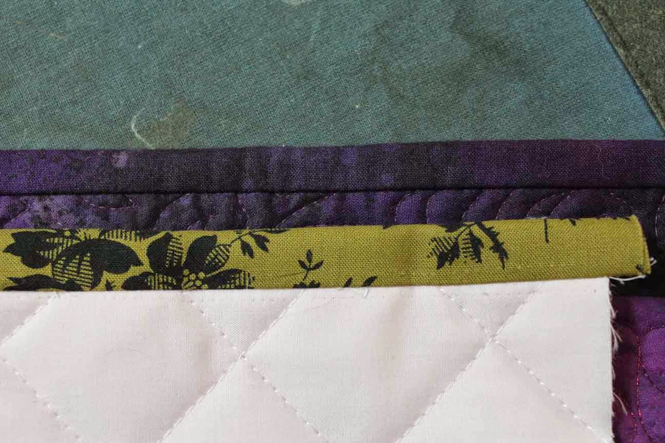 Crazy Quilter on a Bike! Binding a quilt