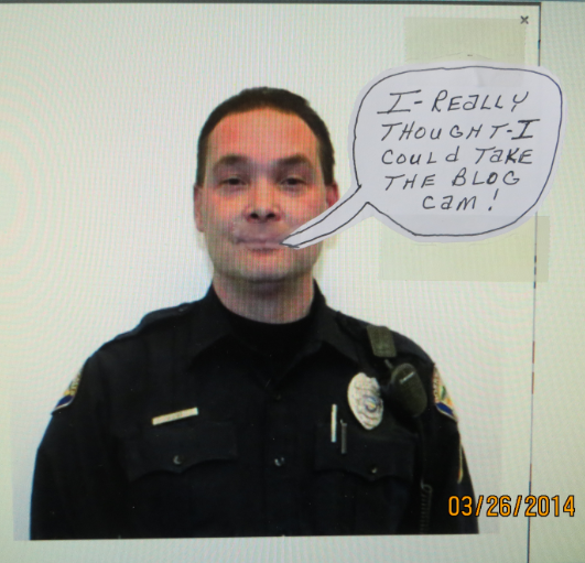 Brady Lake Village cop Jeff Lyle thinks people shouldn't take pictures of cops.