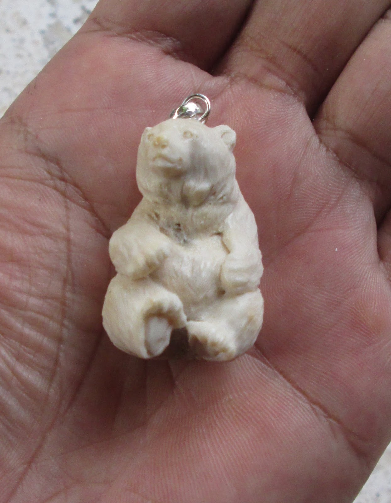 Carved Bear Bone Pendants in Antler Carved Bear Bone Pendants in Antler
