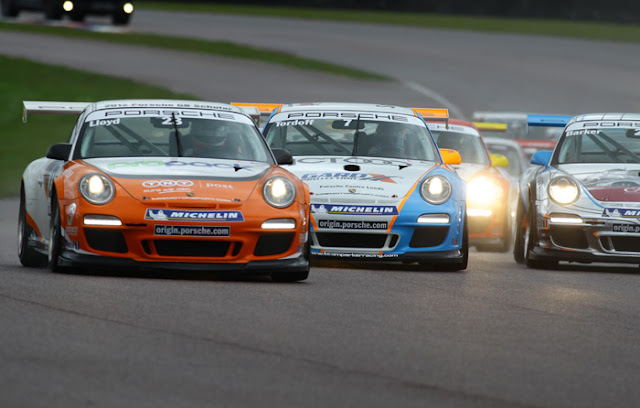 Daniel Lloyd (Car 23, Left)  battles the pack during the Porsche Carerra Cup 2012 