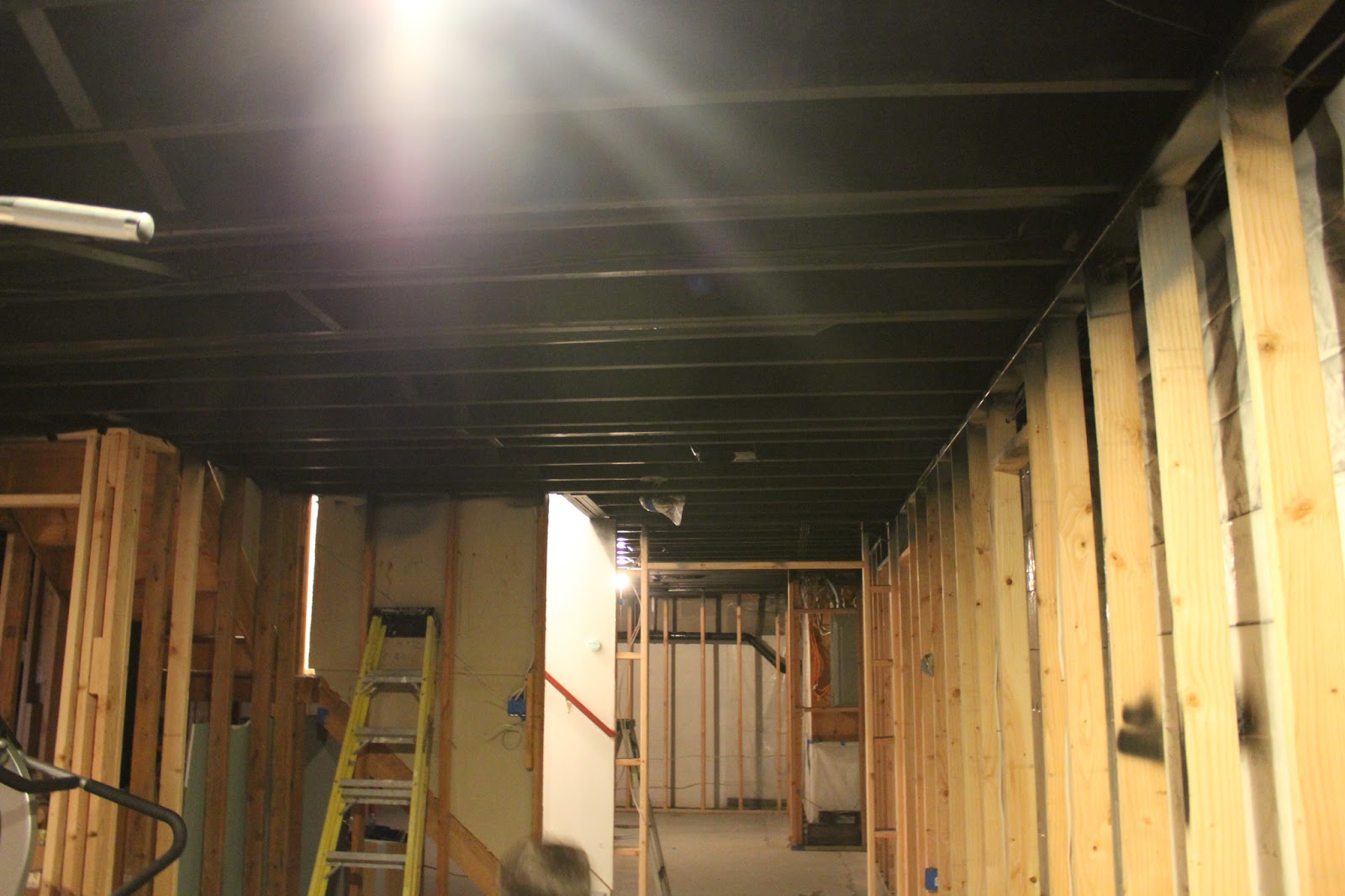Basement Remodel With Painted Exposed Ceiling