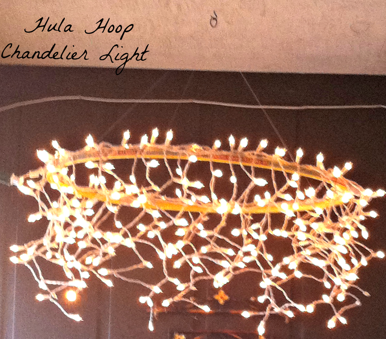 This is my Hula Hoop Chandelier Light, it cost me less than ten dollars to ...