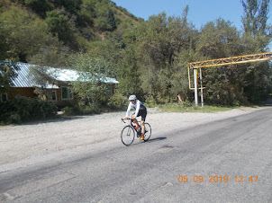 A Cyclist on the Trans-Ili Alatau mountains,