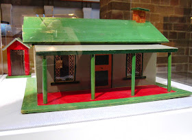 Front view of a vintage toy farm outhouse and house from Sydney shop Walther & Stevenson.