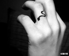 snake tattoo on the finger