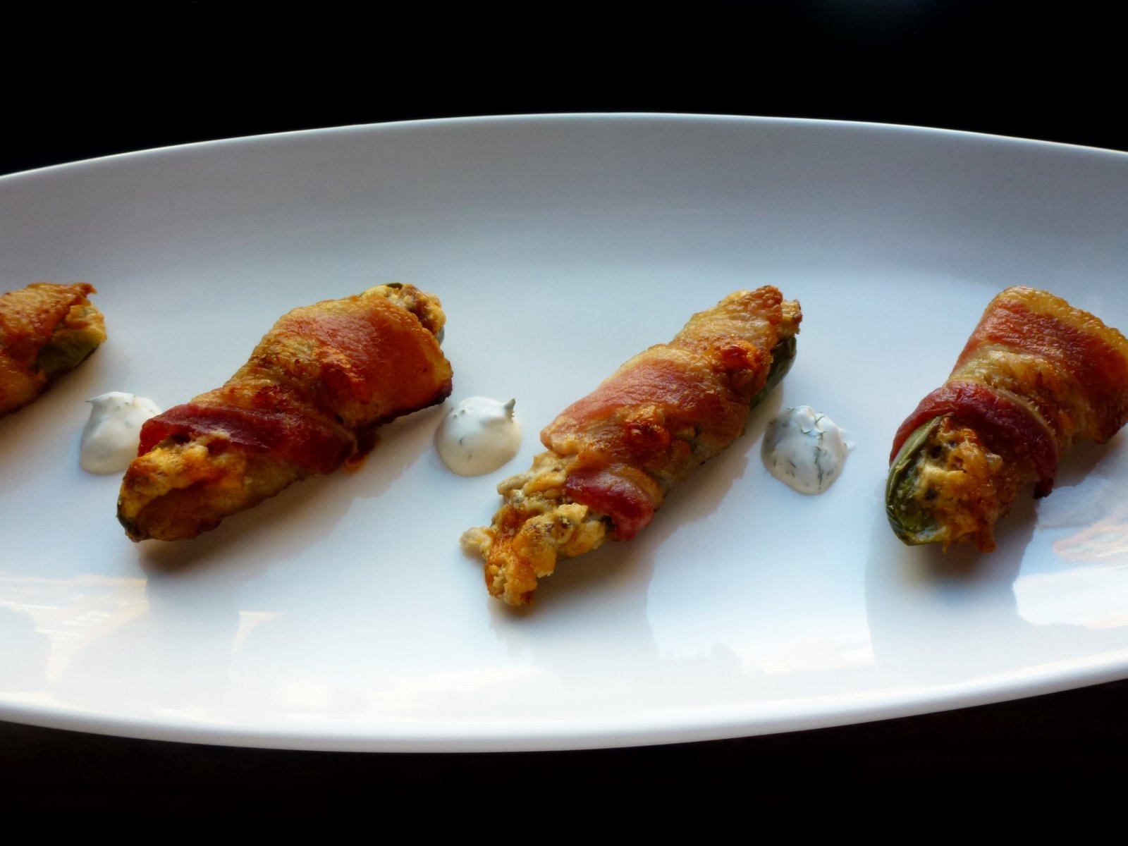 Hardly Housewives Sausage Stuffed Bacon Wrapped Jalapeno Poppers