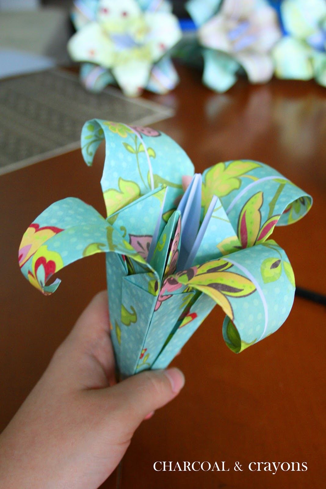 Charcoal and Crayons Folding a Paper Lily