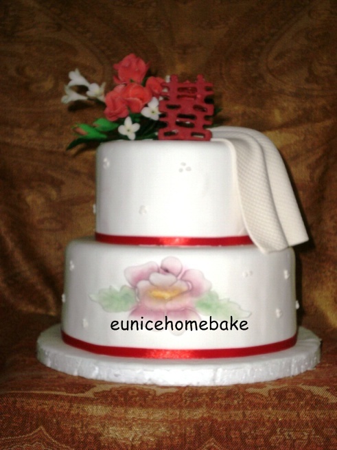 A sample of 2 tier cake suitable for wedding Decorated with roses painting 
