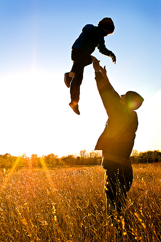 Father holding newborn baby
