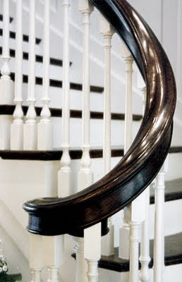 Crisp white paint and dark handrails exude tradition on this Seattle Stair & Design staircase