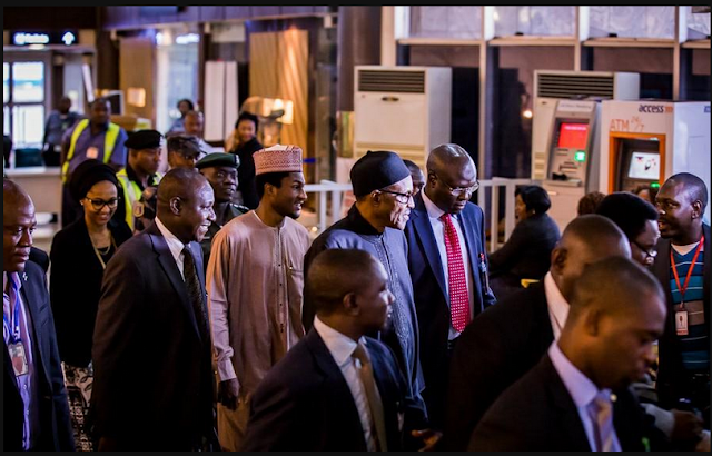 Buhari and his children at Abuja airport