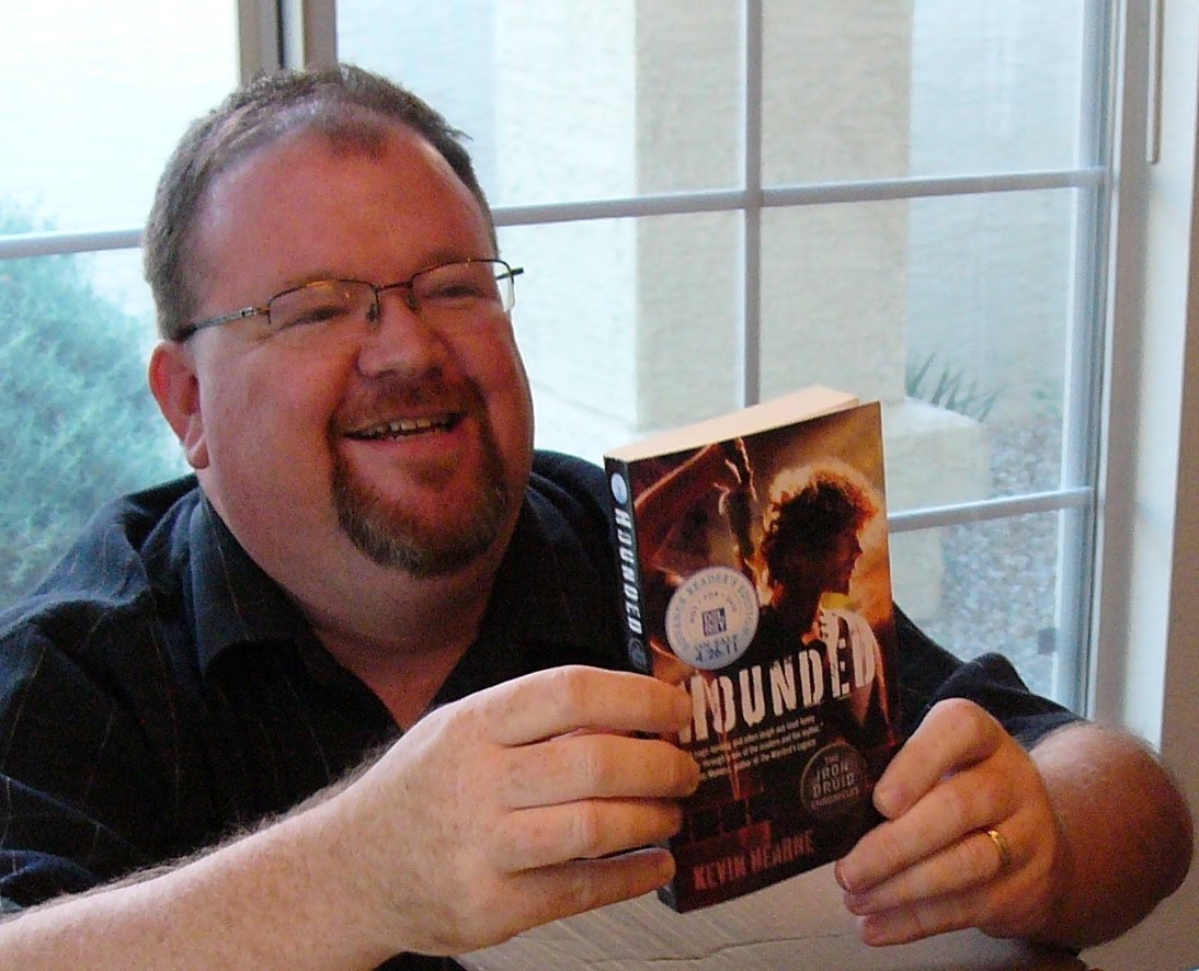 Photo of Kevin Hearne holding Hounded