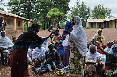 Women performing a skit in the village of Hindè.