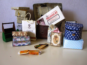 Selection of miniature vintage bags, boxes and a trunk.