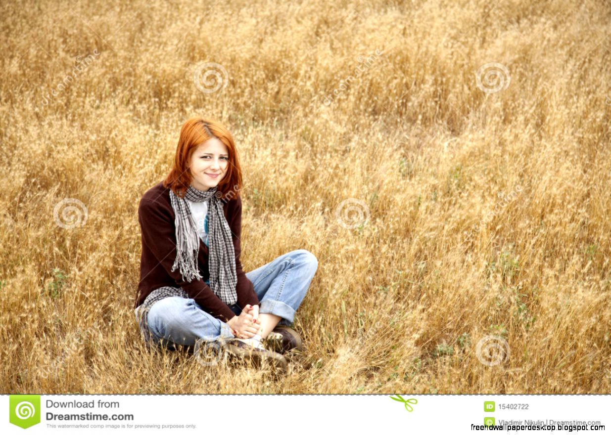 Beautiful Red Haired Girl At Yellow Autumn Grass Stock Photography Beautiful Red Haired Girl At Yellow Autumn Grass Stock Photography