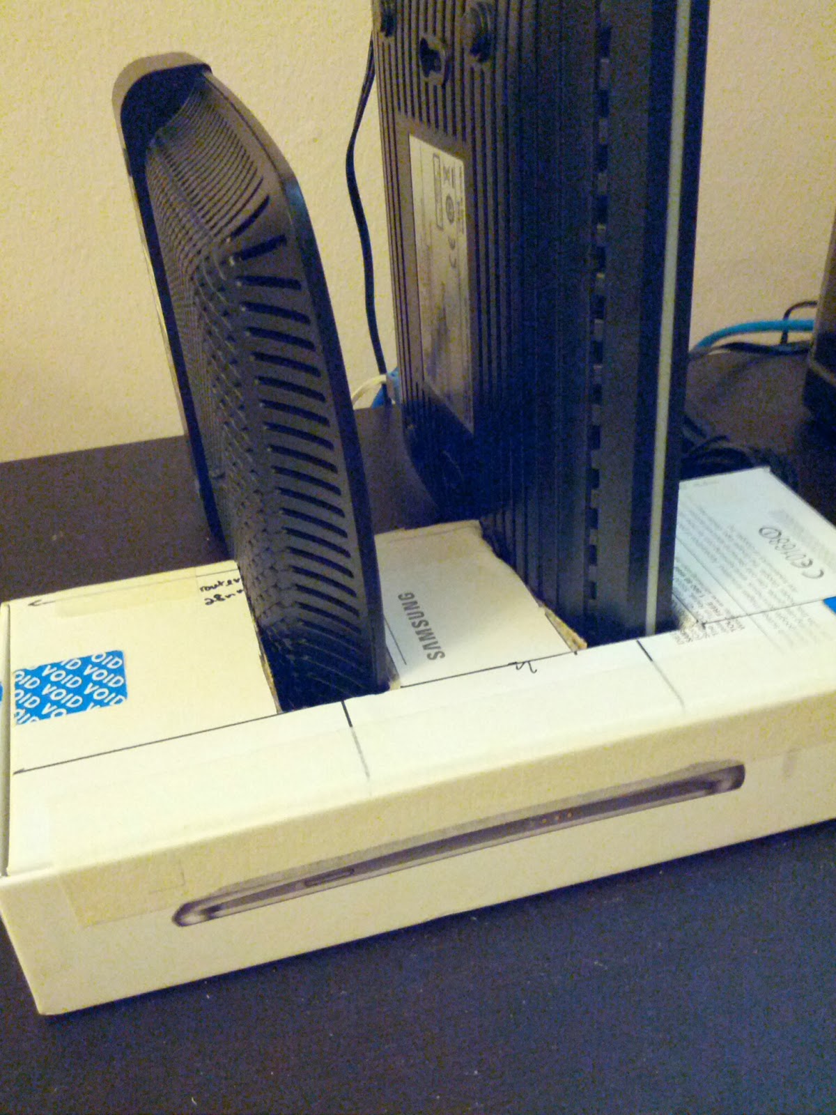 Make a vertical stand for your modem and router to save some table space