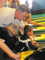 Alexandre and Dad 'bowling" at Chucky Cheese (Maine)