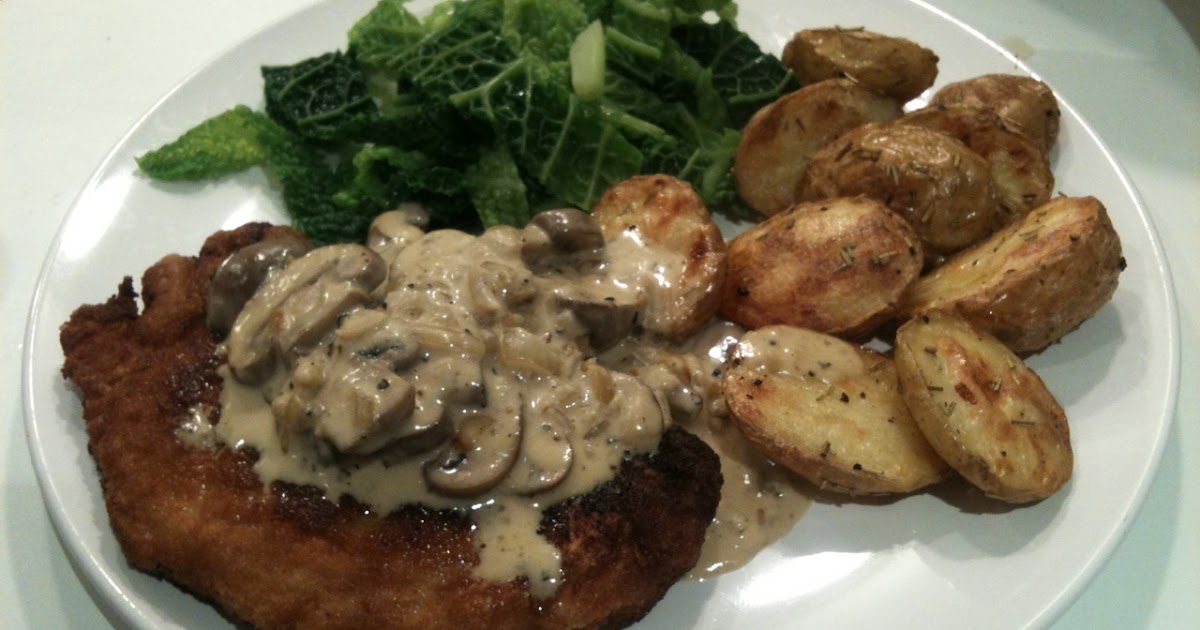 Breaded pork escalope with roasted new potatoes and chestnut mushroom