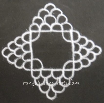 a square centre with bunch of grapes like designs on all sides kids-rangoli-8.jpg