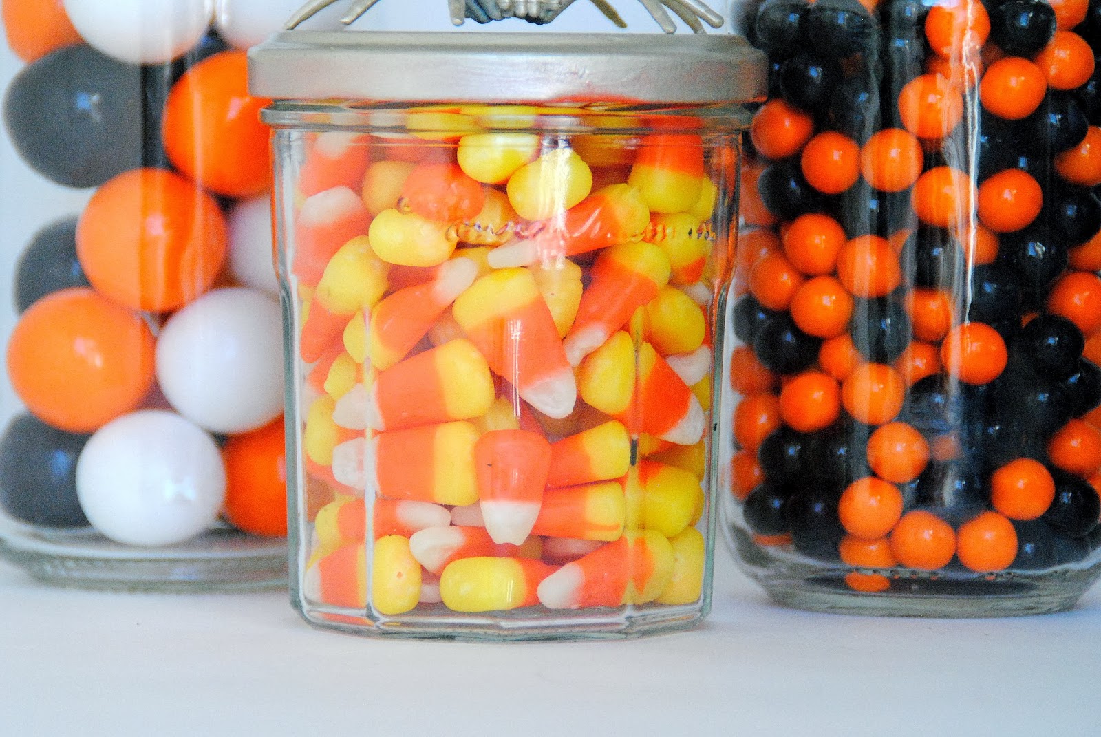 diy spider topped halloween candy jars