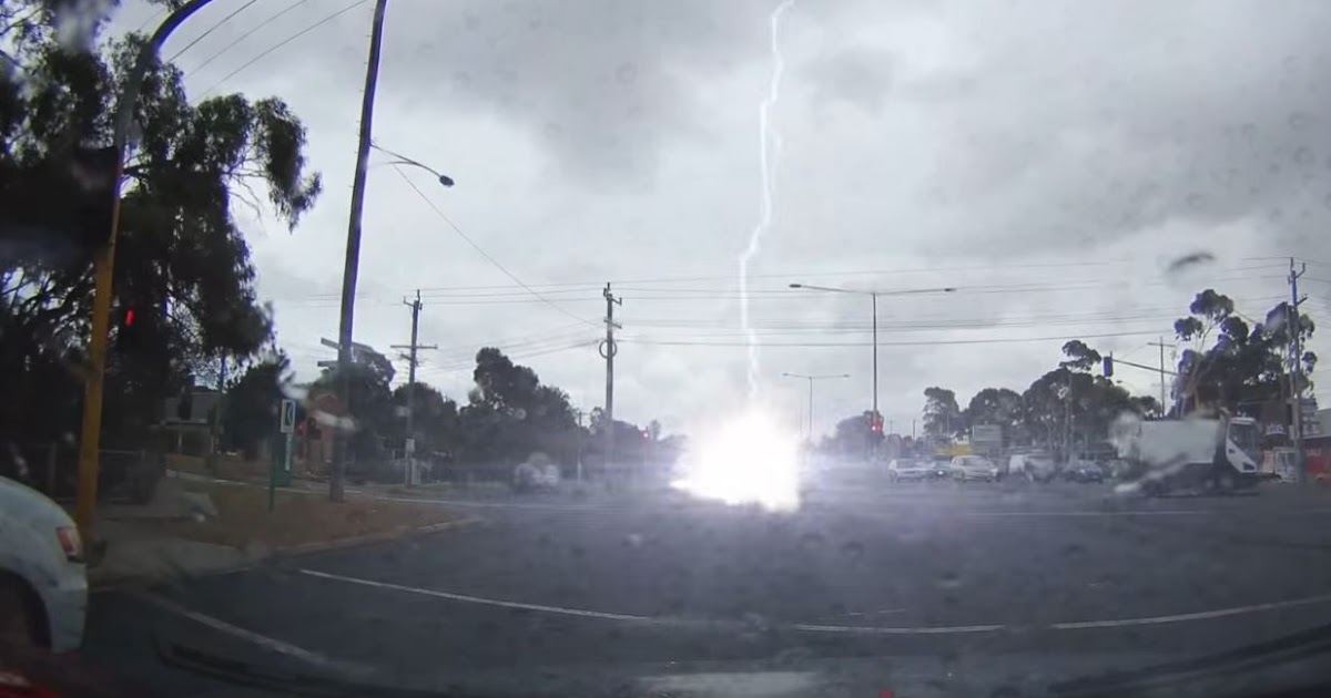 Lightning Strikes Car As It Crosses Intersection Caught On Video!