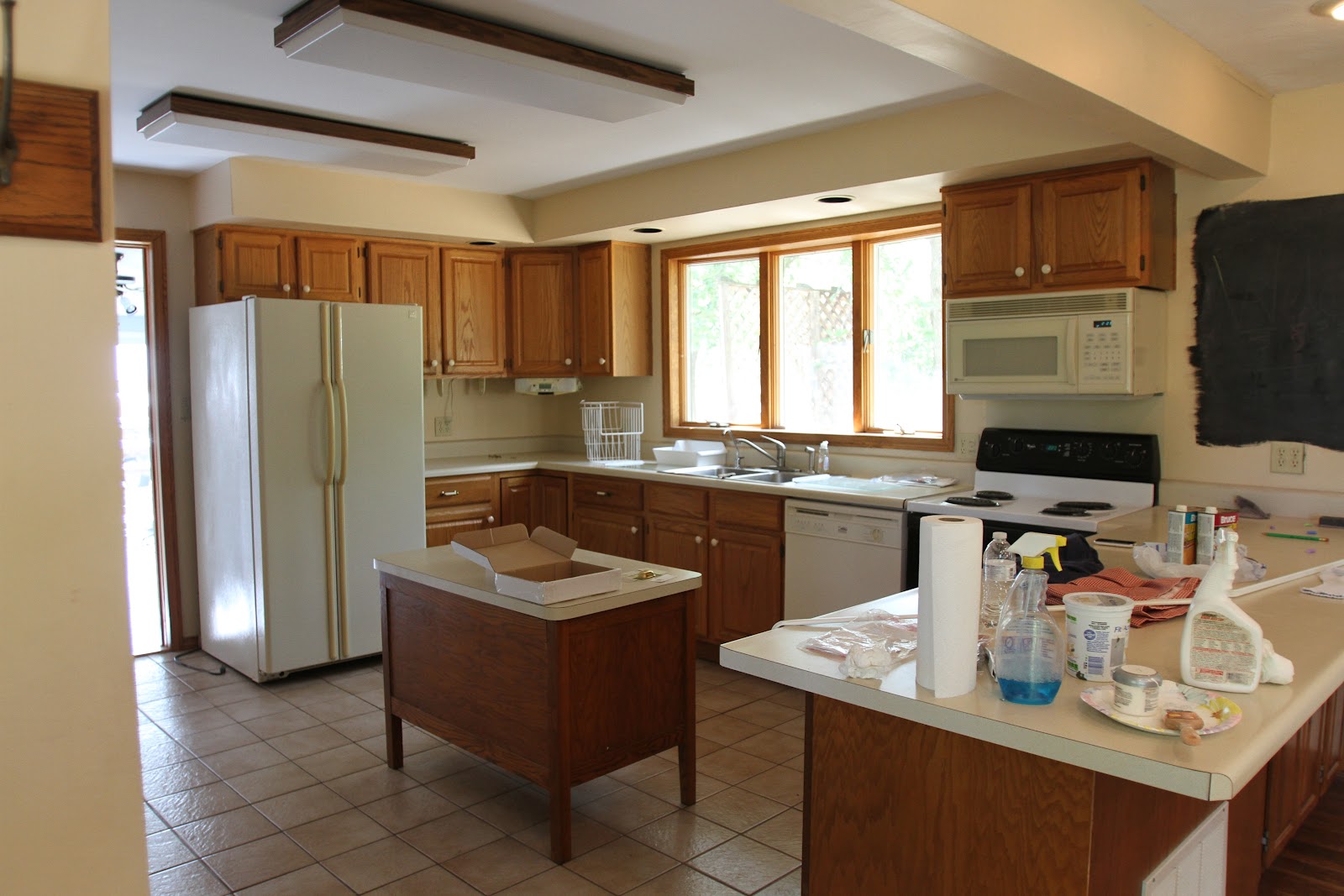 Kitchen sink with cabinet Soffit above Kitchen Cabinets