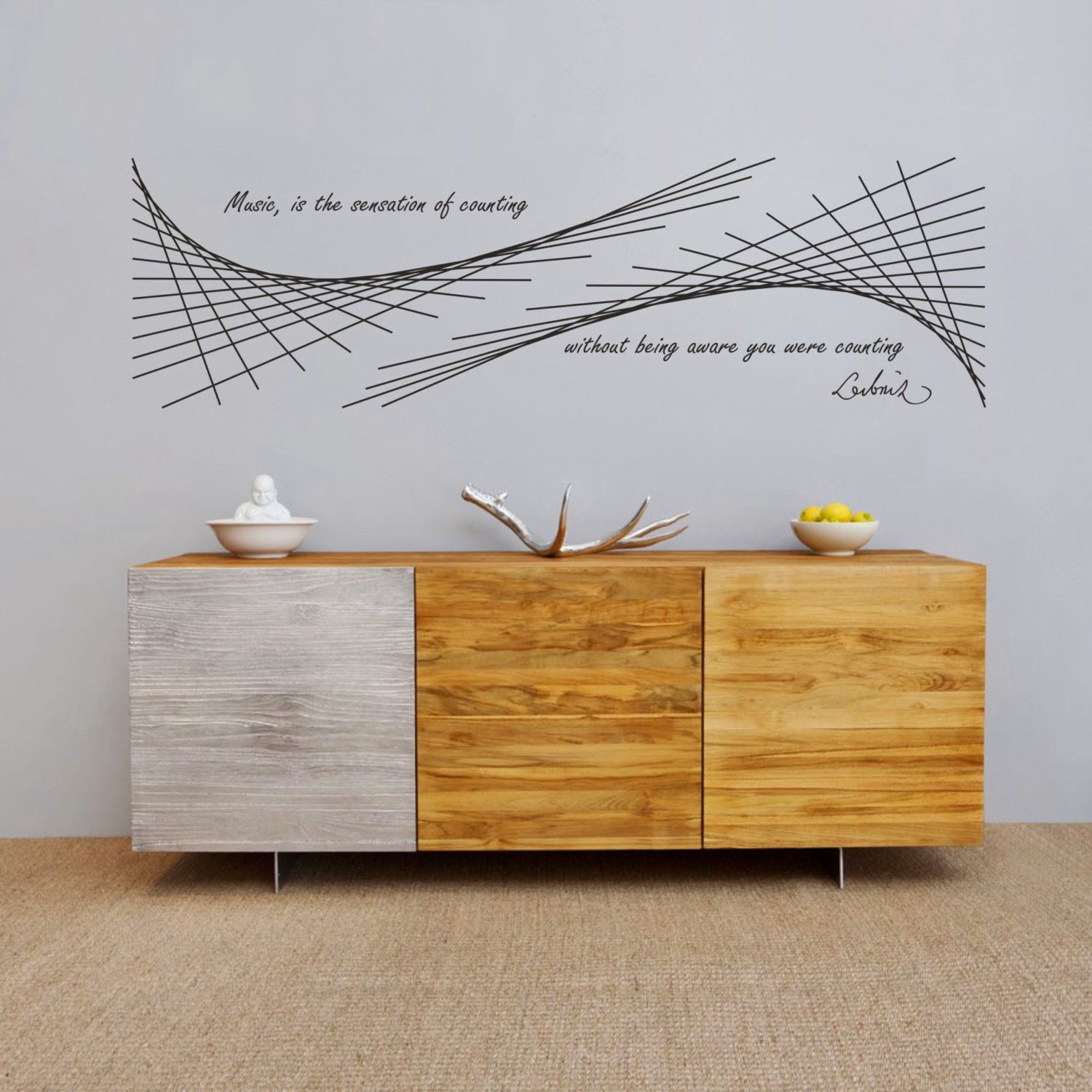 In this science wall decal, Leibniz's famous quote "Music is the sensation of counting without being aware you were counting" accompanies a geometric art, ...