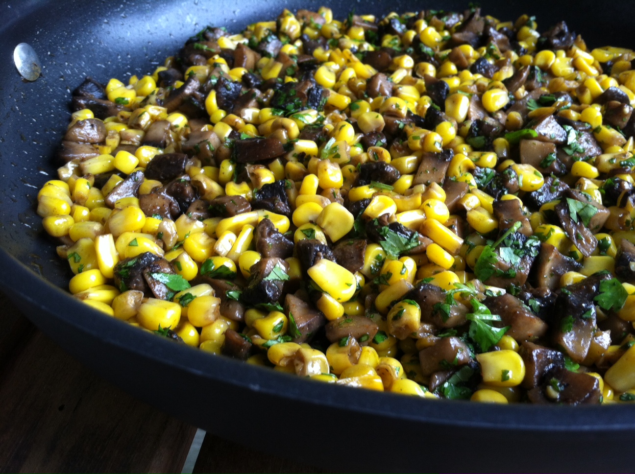 A Taste of Home Cooking Corn and Mushrooms with Cilantro