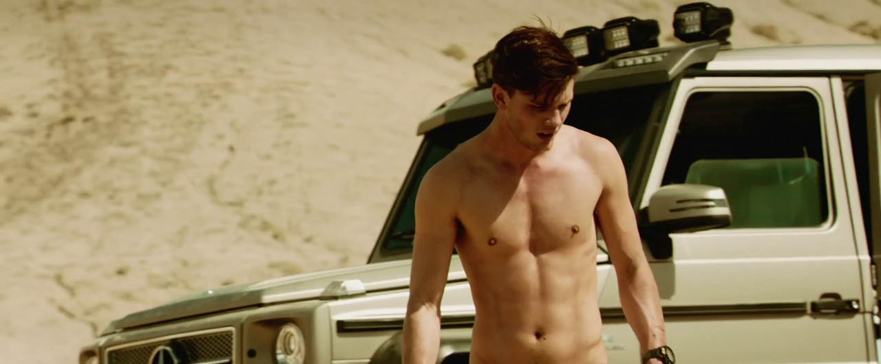 Jeremy Irvine shirtless in Beyond The Reach.