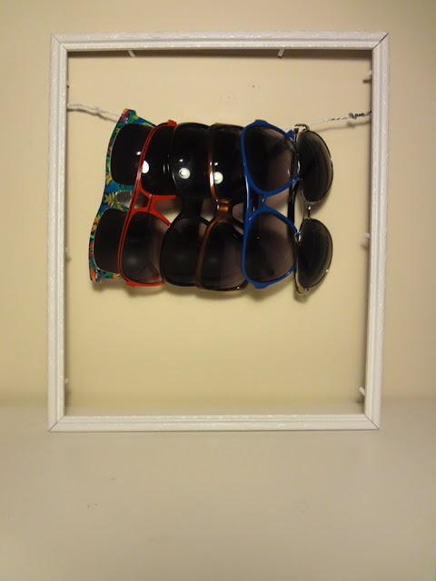 picture frame used as sunglasses holder