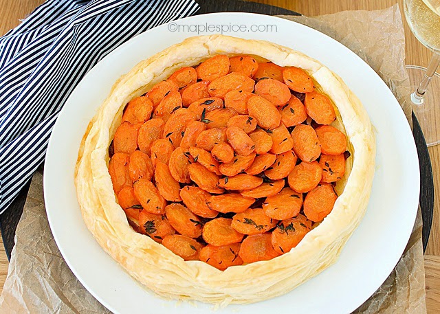 Vegan Carrot and Thyme Puff Pastry Tart with Almond Feta and Caramelized Red Onions.