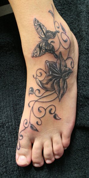chicano tattoo art. flower ankle tattoos.