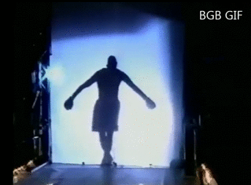 Profile of boxer behind a silk screen dancing