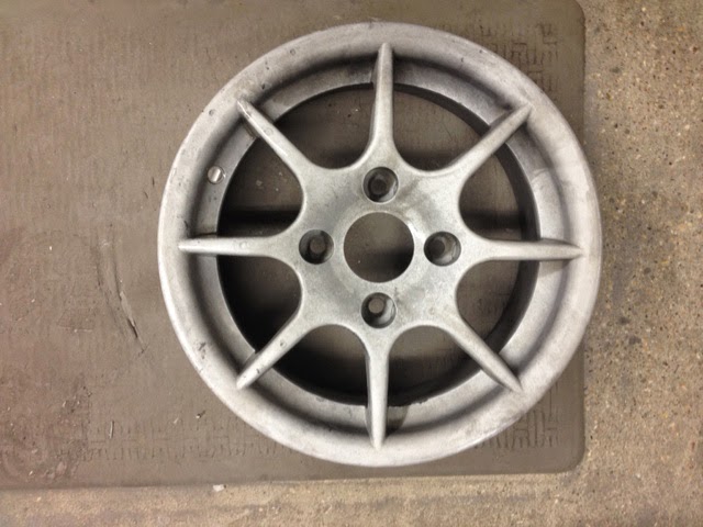 Chemically stripped Caterham R500 8 spoke wheel.
