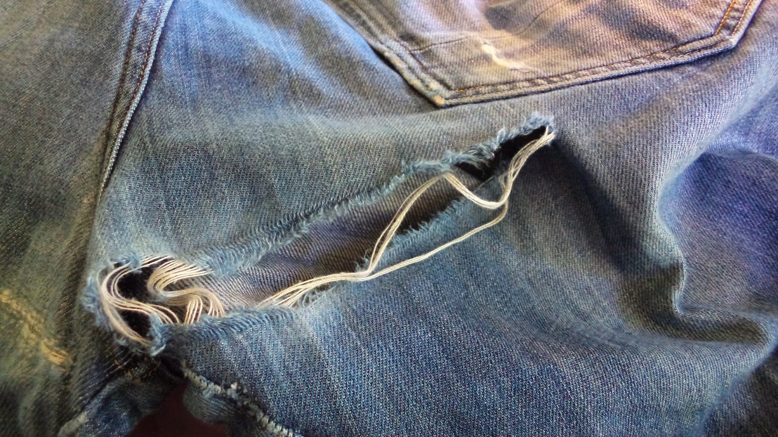 jeans tearing at the bottom