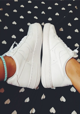 white low top uptowns