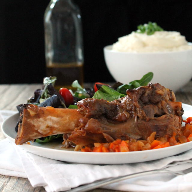 These citrus lamb shanks are fall-off-the-bone tender, served over the slow cooker vegetables. 