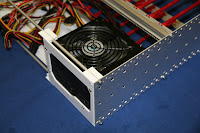 PC power supply mounted to back plate PC power supply mounted to back plate