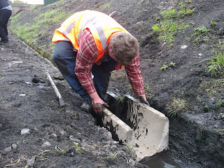 Ryan setting out drainage channels near the signalbox