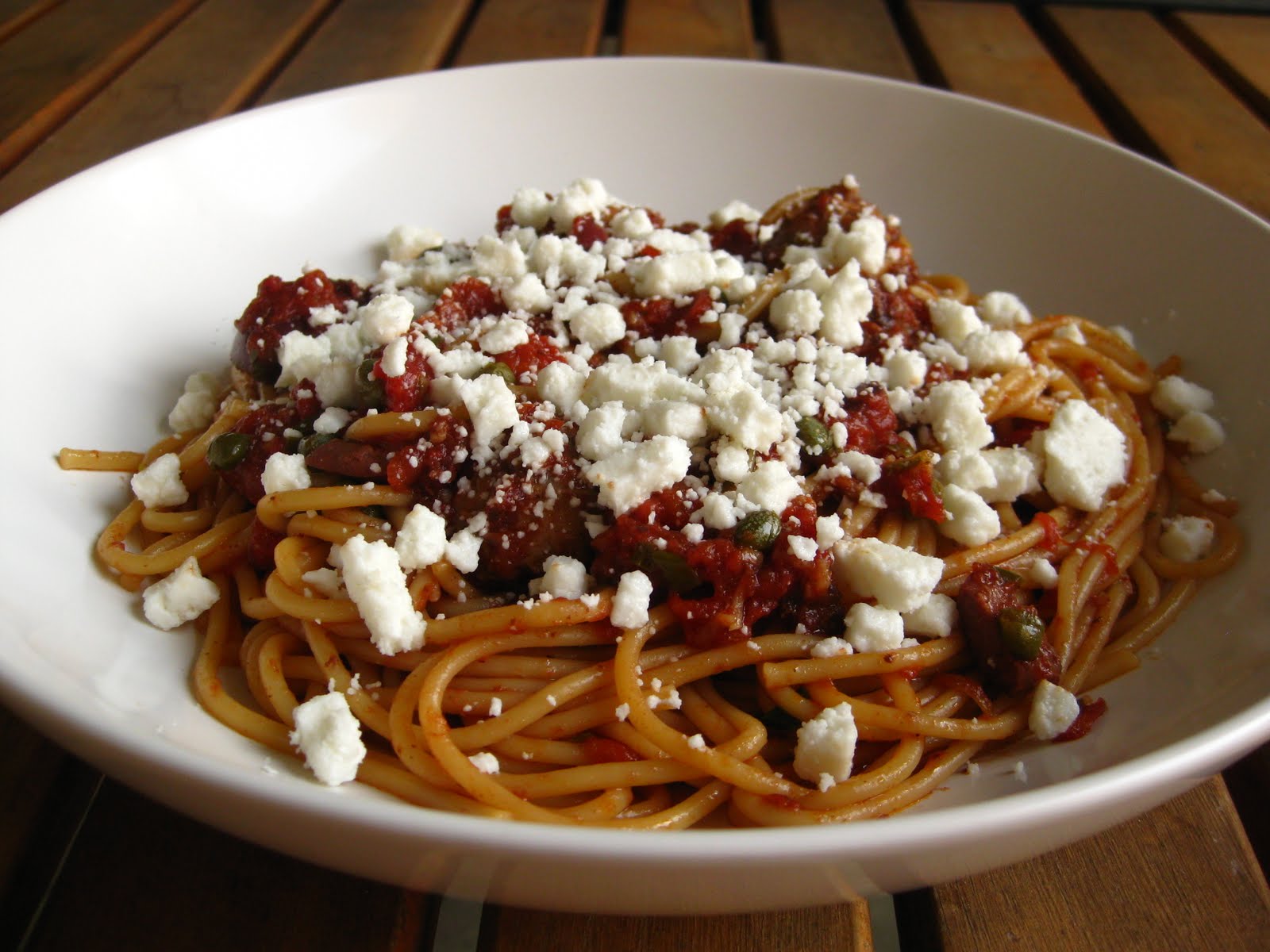 A Taste of Home Cooking Spaghetti with Sausage, Kalamata Olives and Capers