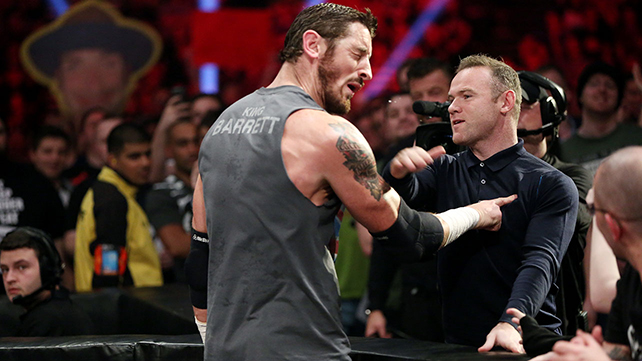  Manchester United captain Wayne Rooney slaps King Barrett at WWE Raw in the UK